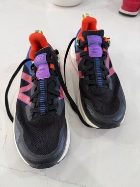 New Balance Black Sneakers with Purple and Orange Accents